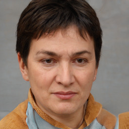 Joyful white adult female with short  brown hair and brown eyes