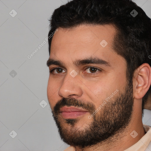 Joyful white young-adult male with short  black hair and brown eyes