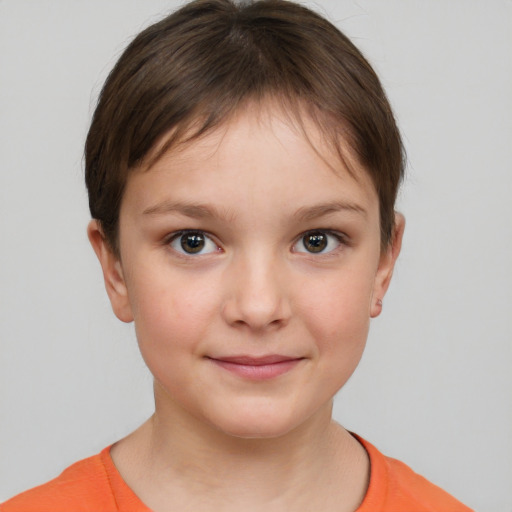 Joyful white child female with short  brown hair and brown eyes