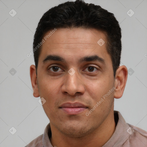 Joyful latino young-adult male with short  black hair and brown eyes