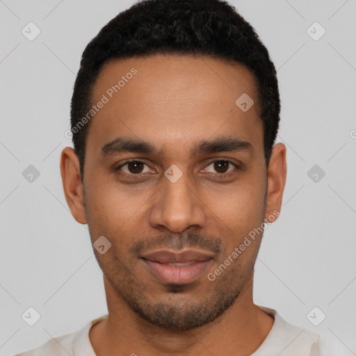 Joyful black young-adult male with short  black hair and brown eyes