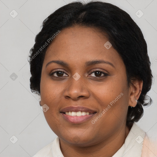 Joyful black adult female with medium  brown hair and brown eyes