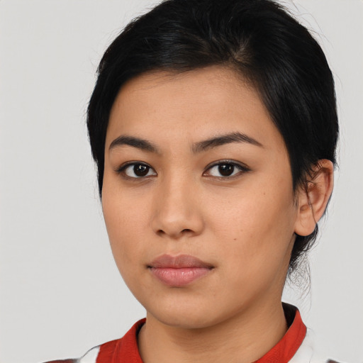 Neutral asian young-adult female with medium  black hair and brown eyes