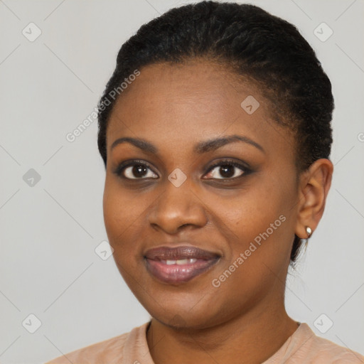 Joyful black young-adult female with short  black hair and brown eyes