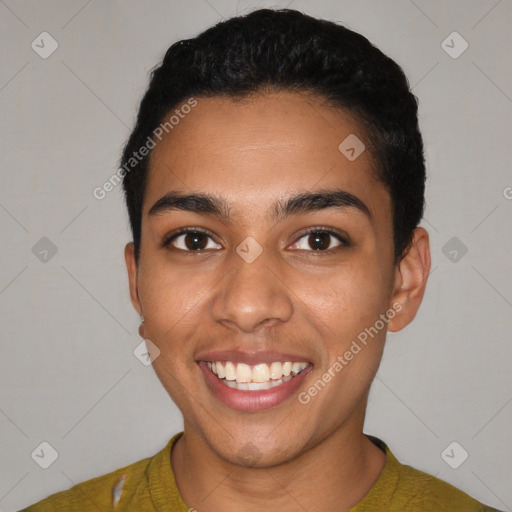 Joyful latino young-adult male with short  black hair and brown eyes