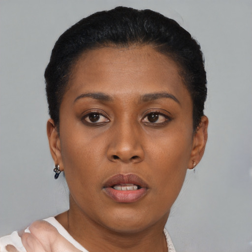 Neutral black young-adult female with short  brown hair and brown eyes