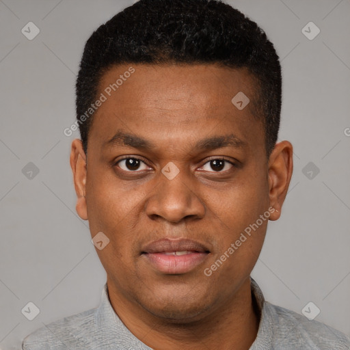 Joyful latino young-adult male with short  brown hair and brown eyes