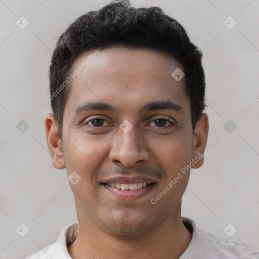 Joyful white young-adult male with short  black hair and brown eyes