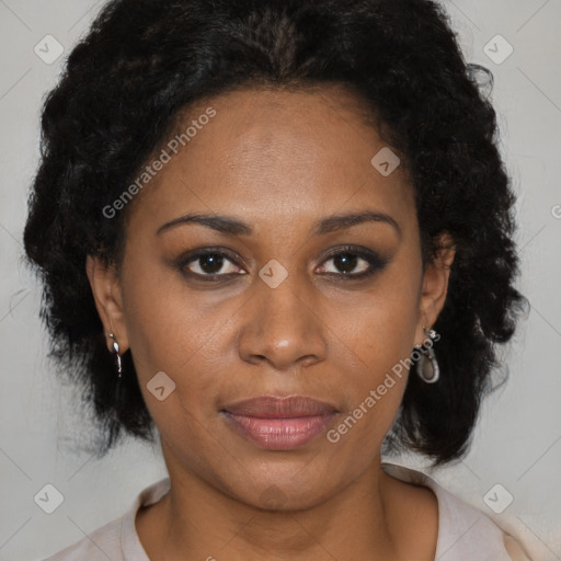 Joyful black adult female with medium  brown hair and brown eyes