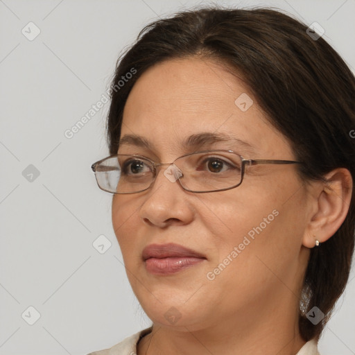 Joyful white adult female with medium  brown hair and brown eyes