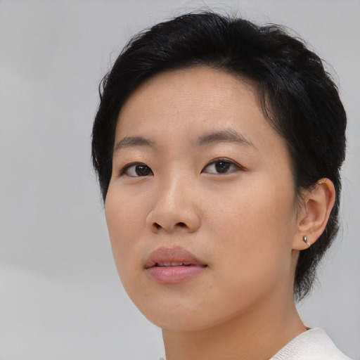 Neutral asian young-adult female with short  black hair and brown eyes
