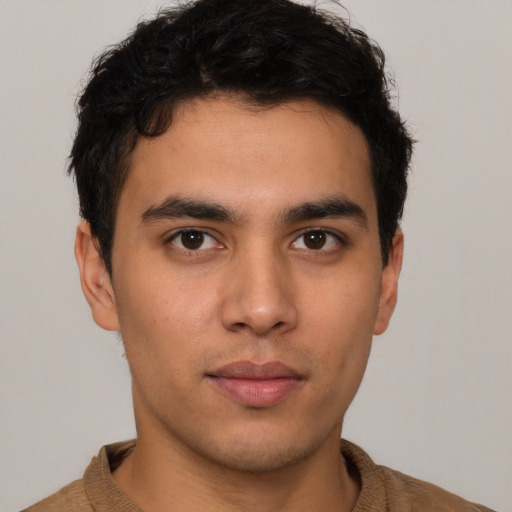 Neutral latino young-adult male with short  brown hair and brown eyes
