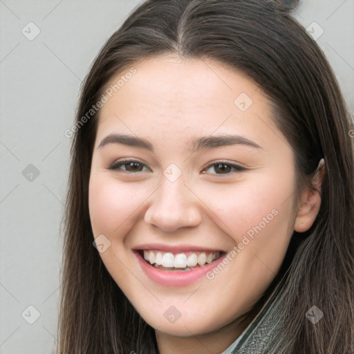 Joyful white young-adult female with long  brown hair and brown eyes