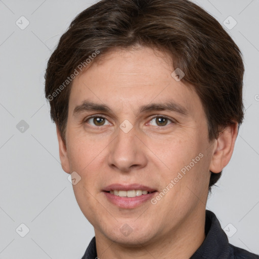 Joyful white adult male with short  brown hair and brown eyes