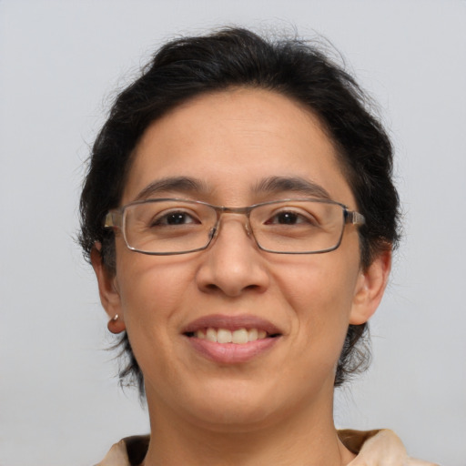 Joyful asian adult female with medium  brown hair and brown eyes