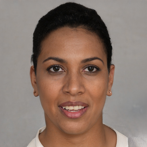 Joyful white young-adult female with short  black hair and brown eyes