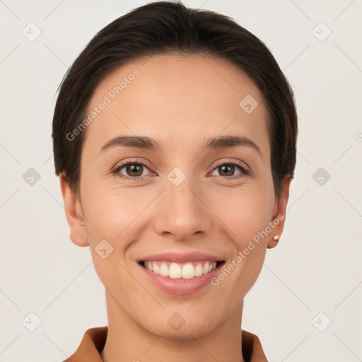 Joyful white young-adult female with short  brown hair and brown eyes