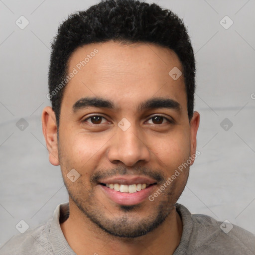 Joyful latino young-adult male with short  black hair and brown eyes