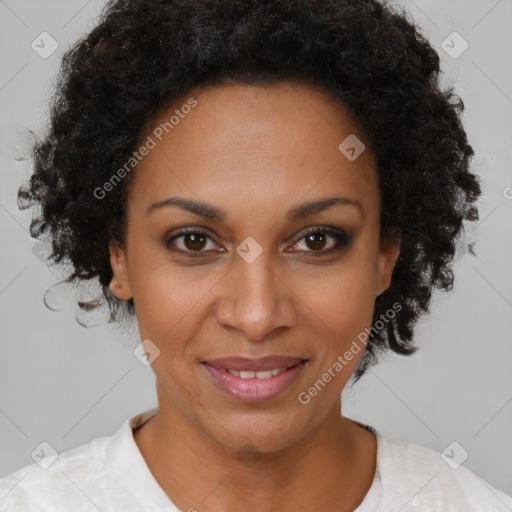 Joyful black adult female with short  brown hair and brown eyes