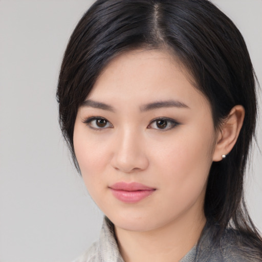 Neutral asian young-adult female with medium  black hair and brown eyes
