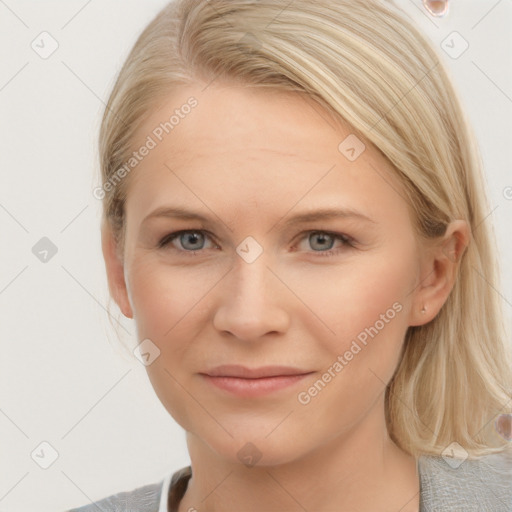 Joyful white young-adult female with medium  brown hair and blue eyes