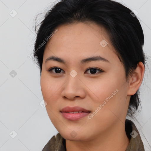 Joyful asian young-adult female with medium  brown hair and brown eyes