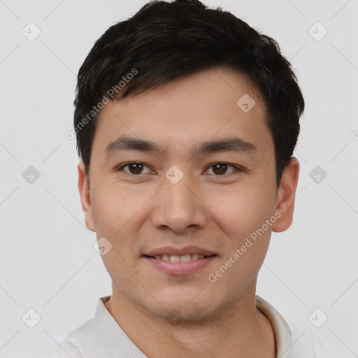 Joyful white young-adult male with short  black hair and brown eyes