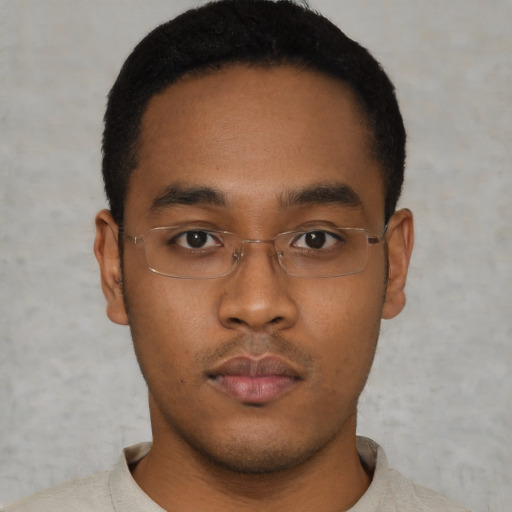 Neutral black young-adult male with short  brown hair and brown eyes
