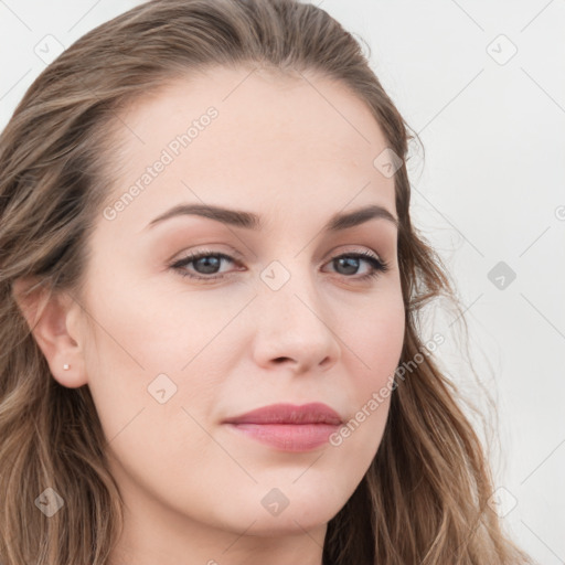 Joyful white young-adult female with long  brown hair and blue eyes