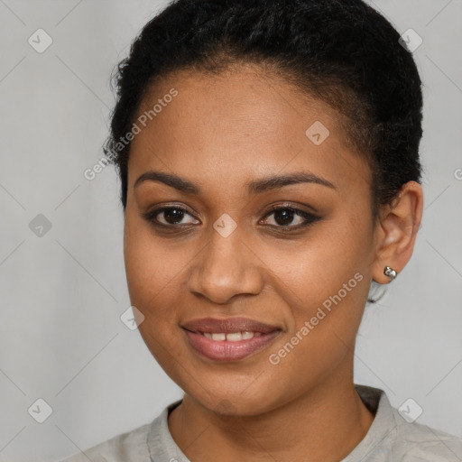 Joyful black young-adult female with short  brown hair and brown eyes