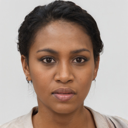 Neutral black young-adult female with short  black hair and brown eyes