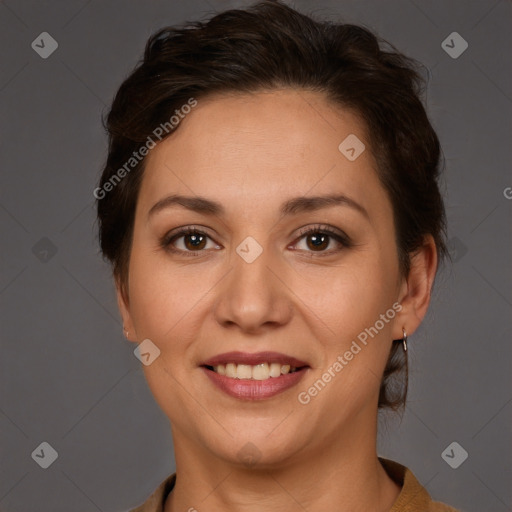 Joyful white adult female with short  brown hair and brown eyes