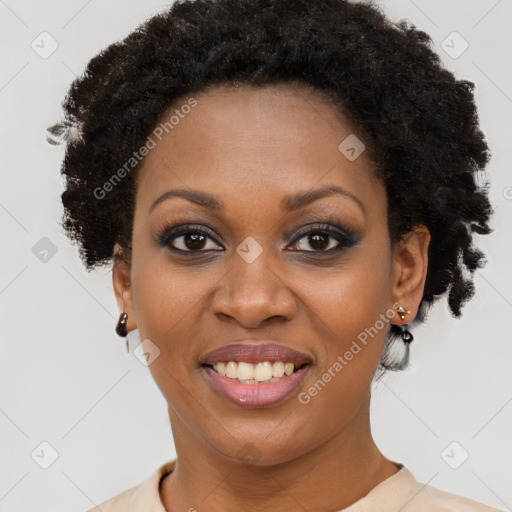 Joyful black young-adult female with short  brown hair and brown eyes