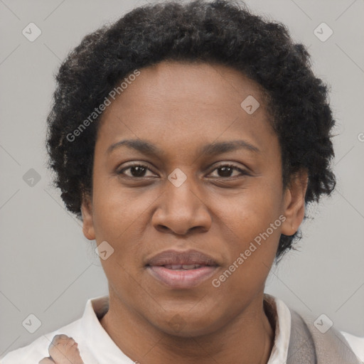 Joyful black adult female with short  brown hair and brown eyes