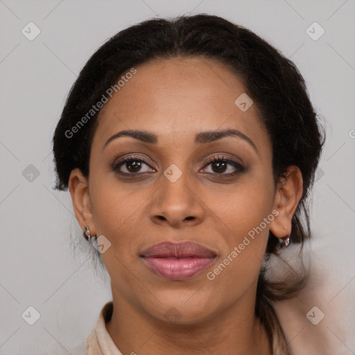 Joyful latino adult female with medium  brown hair and brown eyes