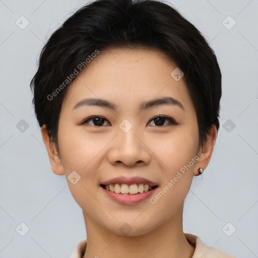 Joyful asian young-adult female with short  brown hair and brown eyes