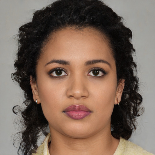 Neutral black young-adult female with medium  black hair and brown eyes