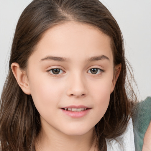 Joyful white child female with long  brown hair and brown eyes