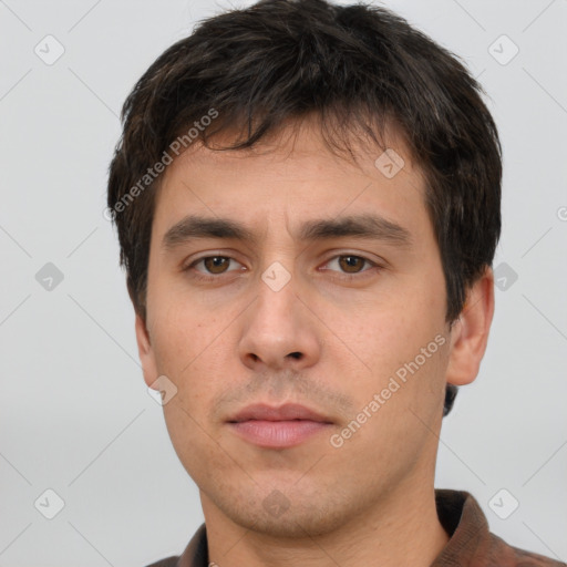 Neutral white young-adult male with short  brown hair and brown eyes