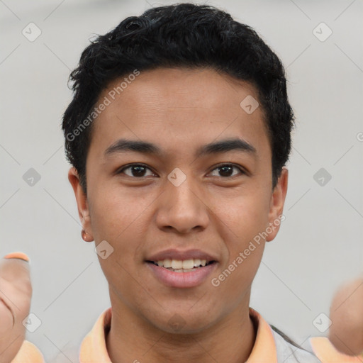 Joyful asian young-adult male with short  black hair and brown eyes