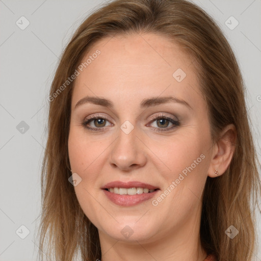 Joyful white young-adult female with long  brown hair and grey eyes