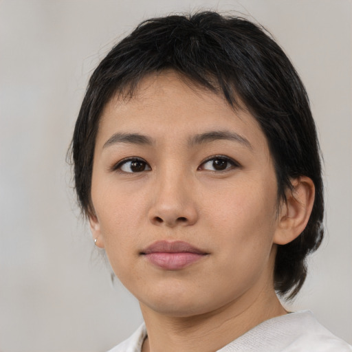 Neutral asian young-adult female with medium  brown hair and brown eyes