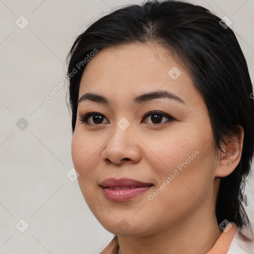 Joyful asian young-adult female with medium  black hair and brown eyes