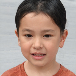 Joyful white child male with short  brown hair and brown eyes