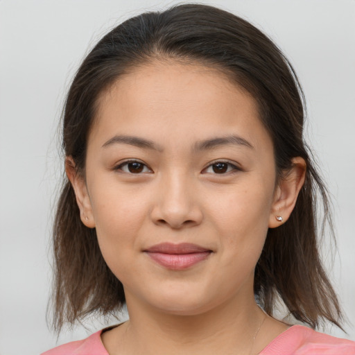 Joyful white young-adult female with medium  brown hair and brown eyes