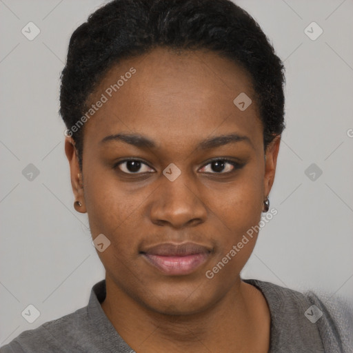 Joyful black young-adult female with short  black hair and brown eyes