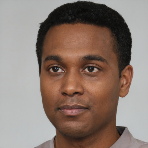Neutral black young-adult male with short  black hair and brown eyes