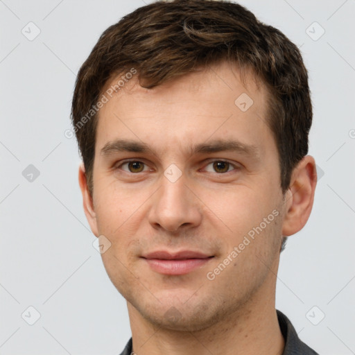 Joyful white young-adult male with short  brown hair and grey eyes