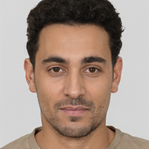 Neutral white young-adult male with short  black hair and brown eyes