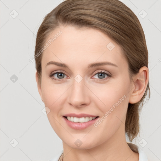 Joyful white young-adult female with medium  brown hair and blue eyes